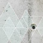 Fotótapéta - Fehér háromszögek betonfalon