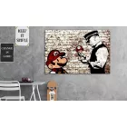 Kép - Banksy rajz szakadt téglafalon